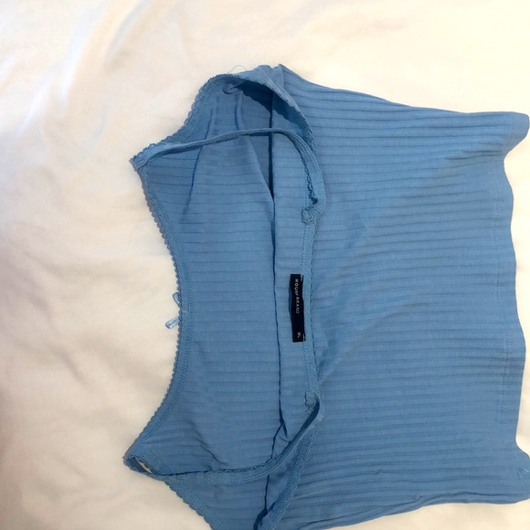 This is a light blue and is cropped tank top. This is from Housebrand! - Picture 3 of 3